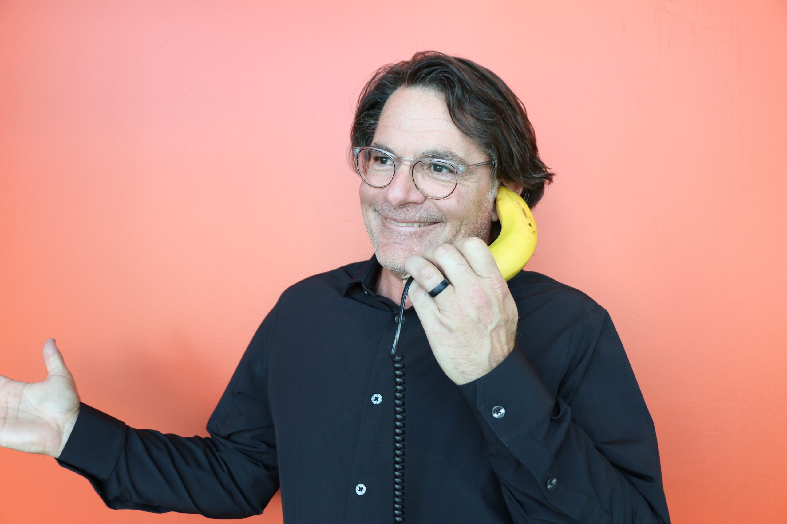 person using a banana as a phone